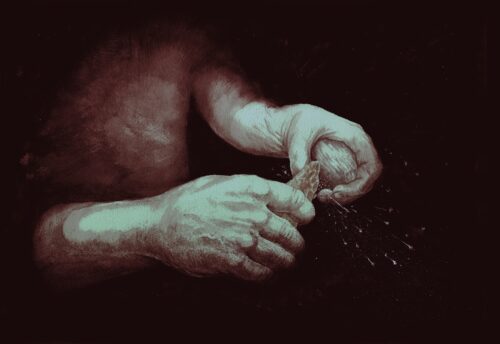 sparks being produced by striking iron pyrite with a flint handaxe